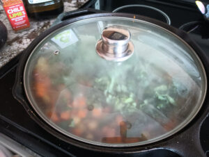 Vegan Sweet Potato Breakfast Hash cooking on the stove